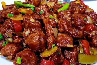 Indo-Chinese chilli chicken with peppers and onions at Green Chili Fine Indian Cuisine, Calgary